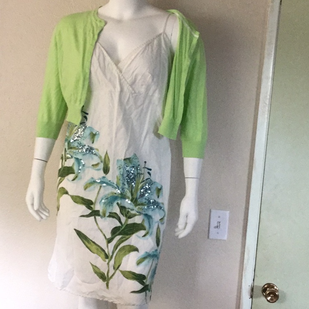 White dress with blue-green flowers & jacket.